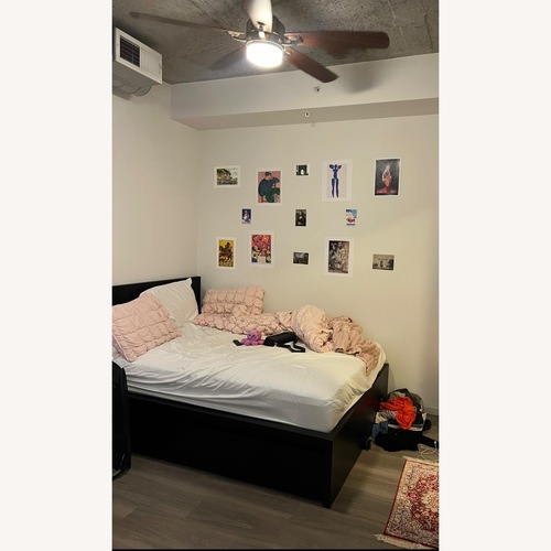 Used IKEA Malm Black Wood Bed w 2 Storage Drawers for sale on AptDeco
