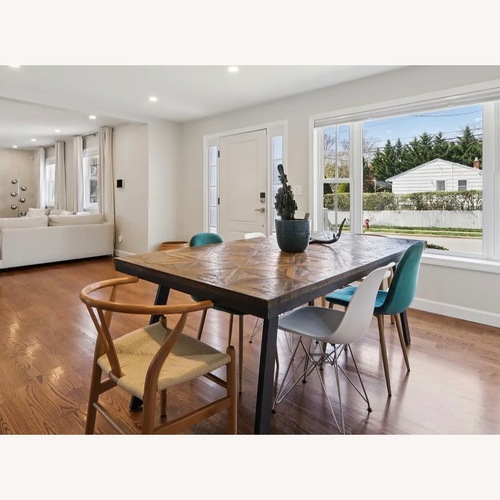 Used Geometric Wood Dining Table with Metal Legs for sale on AptDeco