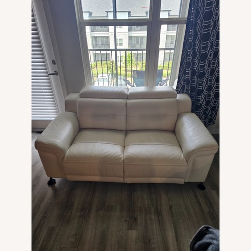 Used Rooms To Go  White Leather Loveseat for sale on AptDeco