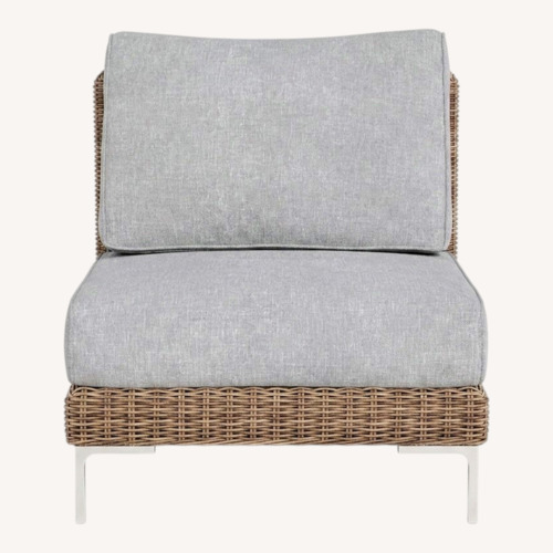 Used Outer Handwoven Brown Wicker Outdoor Armless Chair for sale on AptDeco