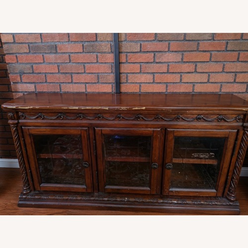 Used Ashley Furniture Dark Brown Wood Coffee Table for sale on AptDeco
