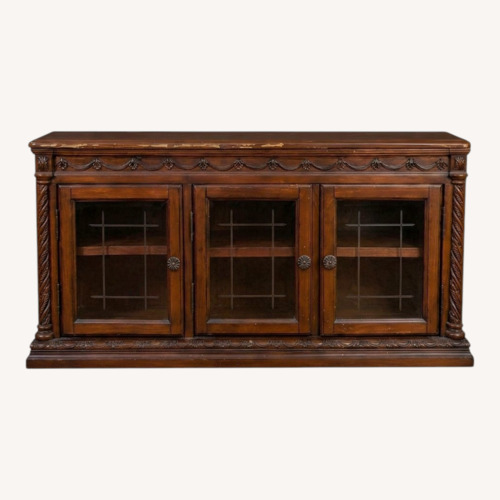Used Ashley Furniture Dark Brown Wood Coffee Table for sale on AptDeco