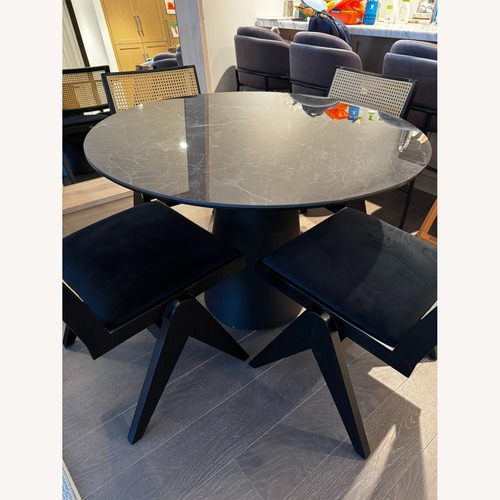 Used Room & Board Round Black Marble Dining Table for sale on AptDeco