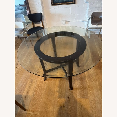Used Crate & Barrel Glass Top Dining Table Seats 4-6 for sale on AptDeco