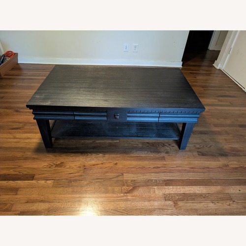 Used Ashley Furniture Miniore Black Wood Coffee Table for sale on AptDeco