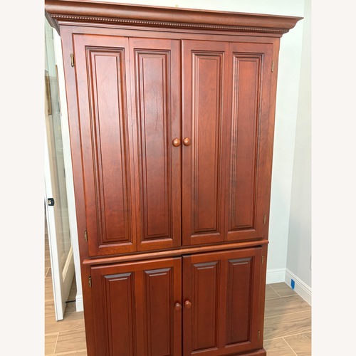 Used Solid Cherry Corner Armoire / TV Cabinet for sale on AptDeco