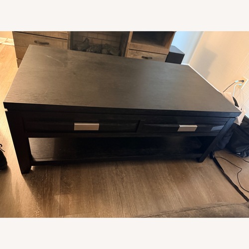 Used Bob's Discount Furniture Elevations Dark Brown Coffee Table for sale on AptDeco