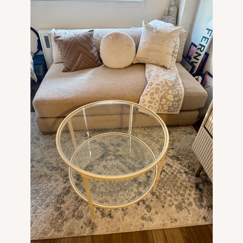 Used Amazon Round Glass Coffee Table for sale on AptDeco