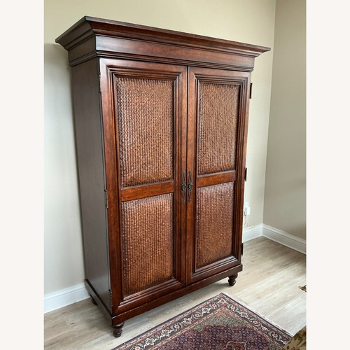Used Dark Brown Wood Armoire TV Cabinet for sale on AptDeco