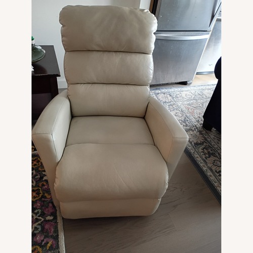 Used Leather Recliner, rocker and rotates 360 for sale on AptDeco
