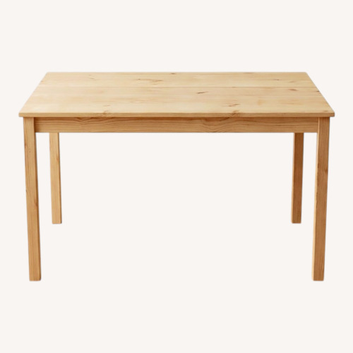 Used IKEA Natural Wood Dining Table for sale on AptDeco