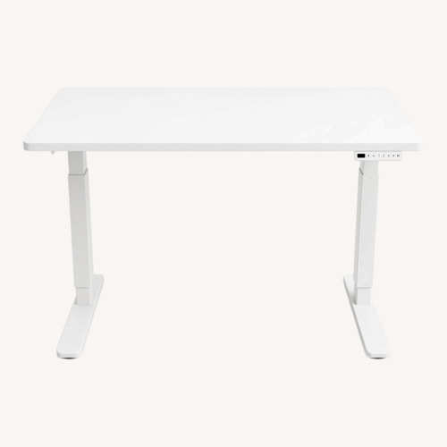 Used UPLIFT White Standing Desk and IKEA Drawer Bundle for sale on AptDeco