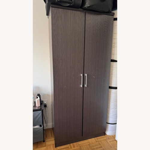 Used Dark Brown Wood Armoire for sale on AptDeco