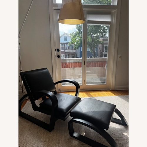 Used Vintage/Antique Black Leather Armchair for sale on AptDeco