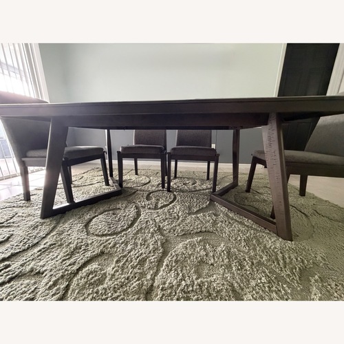 Used Ashley Furniture Dark Gray Wood Dining Table for sale on AptDeco