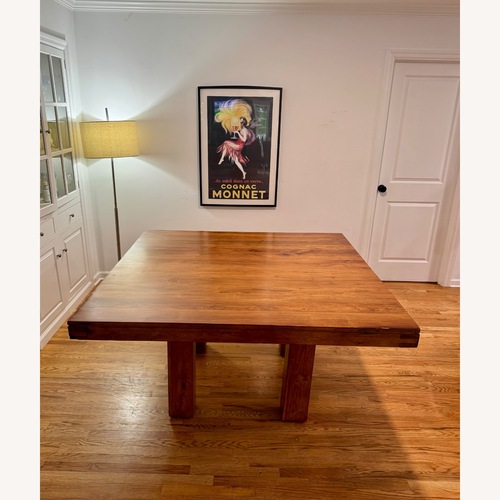 Used Dark Brown Wood Dining Table for sale on AptDeco