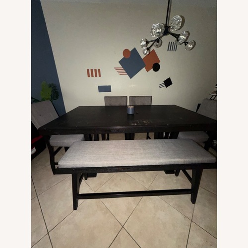 Used Hills Creek Black Wood Dining Set for sale on AptDeco