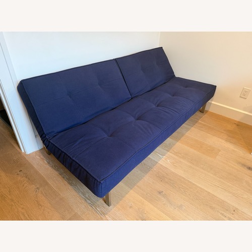Used ABC Carpet and Home Crashpad Blue Futon for sale on AptDeco