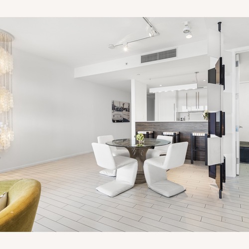 Used Platner-Style Round Glass Dining Table for sale on AptDeco