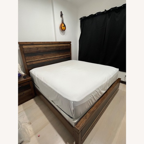 Used Rooms To Go Cindy Crawford Natural Wood King Bed for sale on AptDeco