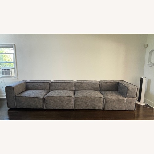 Used Article Quadra Dark Gray Fabric 3+ Piece Sectional for sale on AptDeco