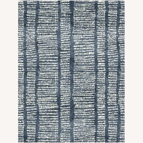 Used Sutherland Perennial Black Area Rug 9' x 12' for sale on AptDeco