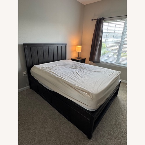 Used Vintage/Antique Dark Brown Wood Full Bed for sale on AptDeco