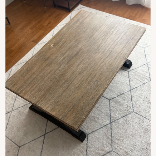Used Rooms To Go Kalani Wood Coffee Table for sale on AptDeco