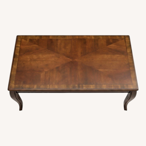 Used Dark Brown Wood Coffee Table for sale on AptDeco
