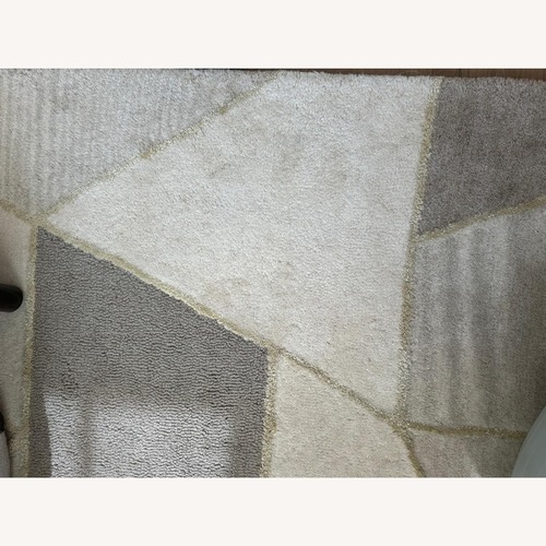 Used West Elm Triangle River Rock Wool Rug 5' x 8' for sale on AptDeco