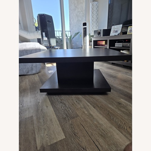 Used Black Wood Coffee Table for sale on AptDeco