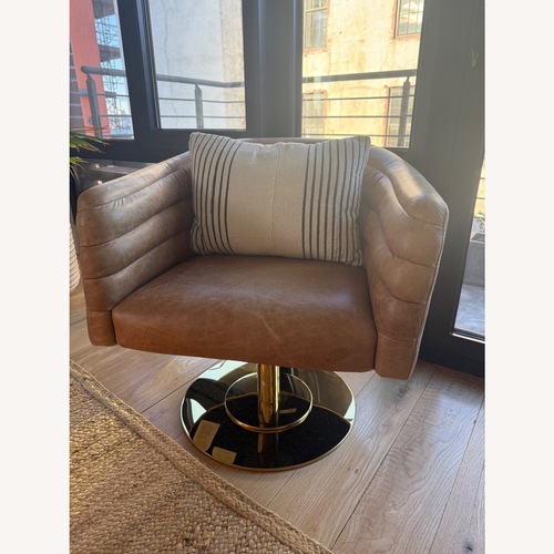 Used  CB2 Brown Leather Cupa Swivel Chair for sale on AptDeco