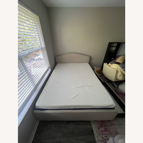 Used IKEA RAMNEFJÄLL Light Brown Fabric Queen Bed for sale on AptDeco