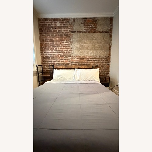 Used Ashley Furniture Dark Brown Queen Bed for sale on AptDeco