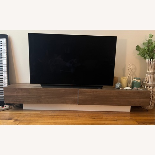Used Dark Brown Wood Media Storage & TV Stand  for sale on AptDeco