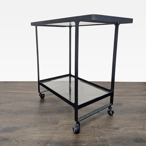 Used Two Tier Glass and Metal Console Table on Castors	 for sale on AptDeco