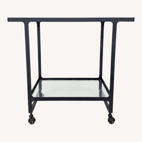 Used Two Tier Glass and Metal Console Table on Castors	 for sale on AptDeco
