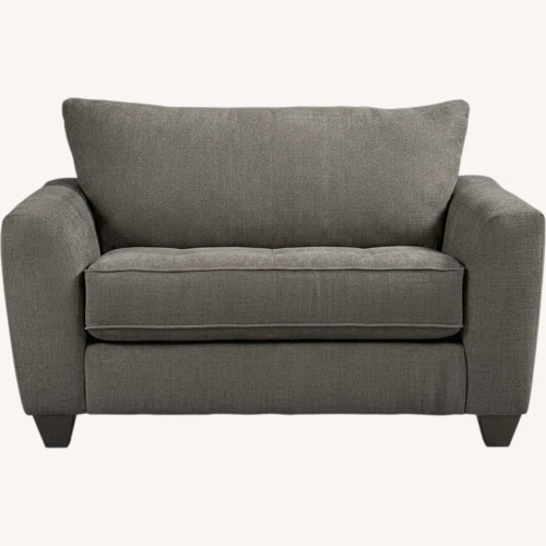 Used Rooms To Go Dark Gray Fabric Loveseat for sale on AptDeco