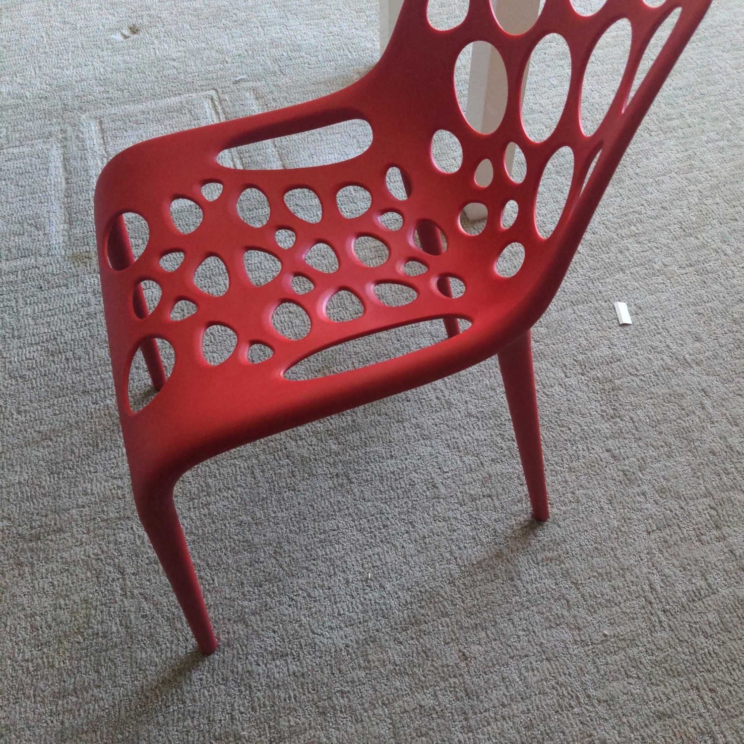 Red Plastic Dining Chair with Circle Cut-Outs	 - image-1
