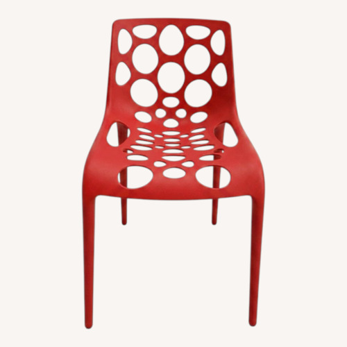 Used Red Plastic Dining Chair with Circle Cut-Outs	 for sale on AptDeco