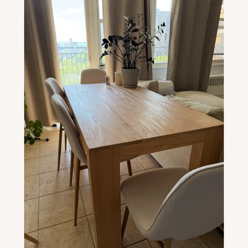 Used Natural Wood Dining Table for sale on AptDeco