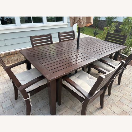 Used Pottery Barn Dark Brown Wood Patio Furniture for sale on AptDeco