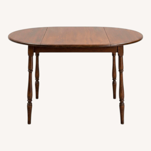 Used Oak Oval Dining Table w Folding Side Leaves for sale on AptDeco