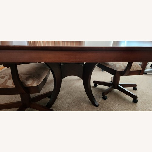 Used Rectangular Dining Table with 6 Swivel Chairs for sale on AptDeco