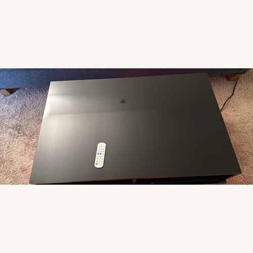 Used Coffee Table with LED Lights and Drawers for sale on AptDeco