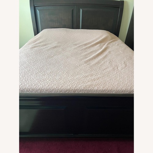 Used Ashley Furniture Dark Brown Wood King Bed for sale on AptDeco