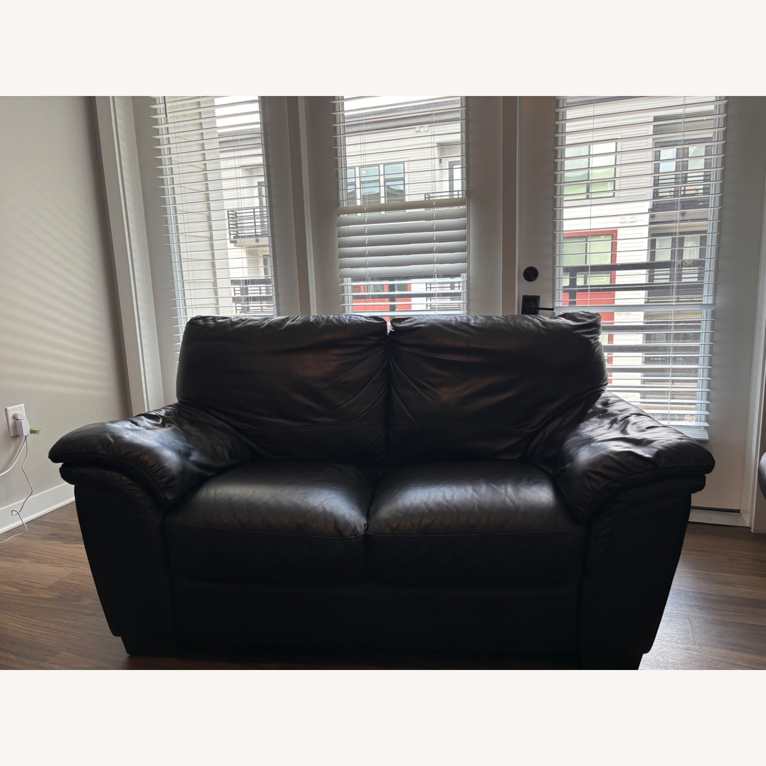 Italsofa Black Leather Loveseat + Rolling Ottoman - image-1