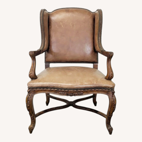 Used Leather & Wood Lounge Chair with Carved Details	 for sale on AptDeco