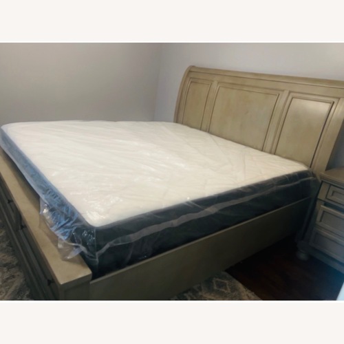 Used Ashley Furniture Light Gray Wood King Bed for sale on AptDeco