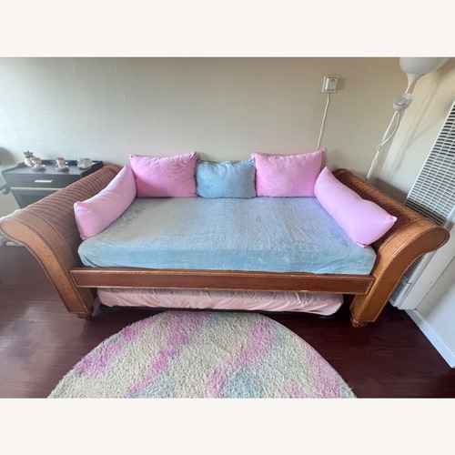 Used Rattan Daybed with Twin Bed Trundle for sale on AptDeco
